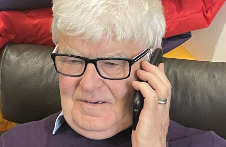 An older carer on the phone